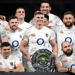 LONDON, ENGLAND - MARCH 07: Owen Farrell and teammates celebrate with the Triple Crown Trophy following their victory in the 2020 Guinness Six Nations match between England and Wales at Twickenham Stadium on March 07, 2020 in London, England. (Photo by Shaun Botterill/Getty Images)