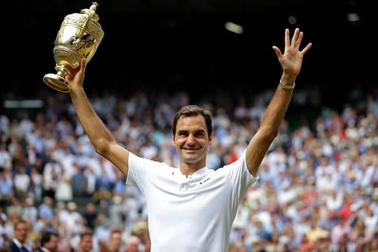 LONDON, ENGLAND - JULY 16: Roger Federer of Switzerland celebrates victory with the trophy after the Gentlemen's Singles final against Marin Cilic of Croatia on day thirteen of the Wimbledon Lawn Tennis Championships at the All England Lawn Tennis and Croquet Club at Wimbledon on July 16, 2017 in London, England. (Photo by Daniel Leal-Olivas - Pool/Getty Images)